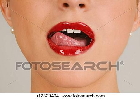 Female young adult mouth; tongue licking lips View Large Photo Image Picture - Female young adult mouth; tongue licking lips. Fotosearch