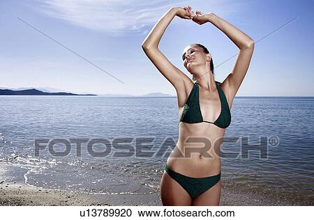 Female young adult on beach View Large Photo Image Stock Image - Female young adult on beach. Fotosearch