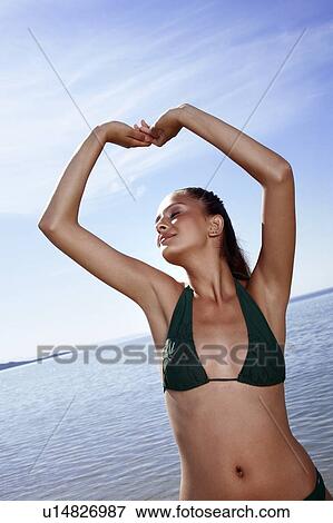 Female young adult on beach View Large Photo Image Stock Photo - Female young adult on beach. Fotosearch