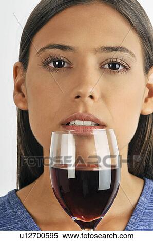 Female young adult smelling a glass of red wine View Large Photo Image Stock Photography - Female young adult smelling a glass of red wine. Fotosearch