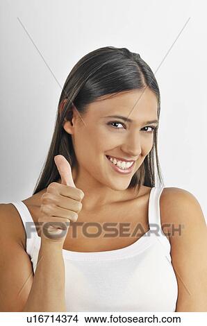 Picture - Female young adult; thumbs up. Fotosearch