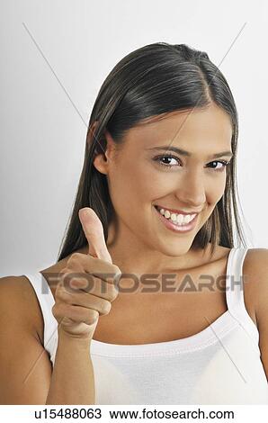 Stock Image - Female young adult; thumbs up. Fotosearch