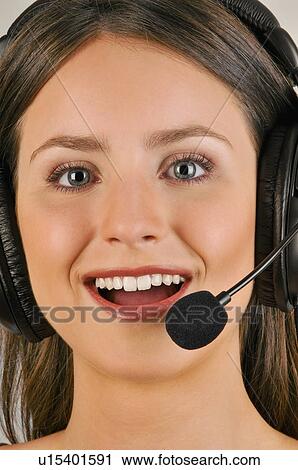 Female young adult with microphone headset View Large Photo Image Stock Image - Female young adult with microphone headset. Fotosearch