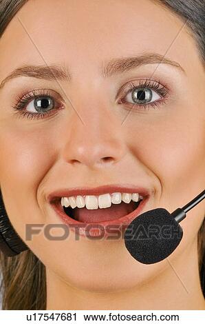 Female young adult with microphone headset View Large Photo Image Stock Image - Female young adult with microphone headset. Fotosearch