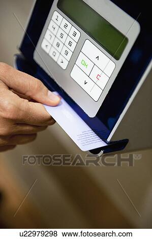 Hand scanning card through machine View Large Photo Image Stock Photo - Hand scanning card through machine. Fotosearch