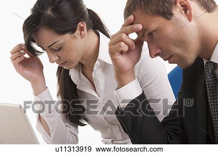 Stock Photo - Man and woman dealing with failure. Fotosearch