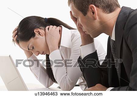 Man and woman with heads in hands View Large Photo Image Stock Image - Man and woman with heads in hands. Fotosearch