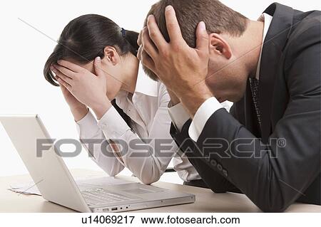 Man and woman with heads in hands View Large Photo Image Stock Photo - Man and woman with heads in hands. Fotosearch