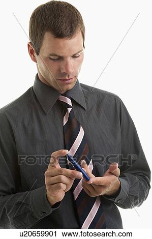 Man holding blood sugar test View Large Photo Image Stock Image - Man holding blood sugar test. Fotosearch