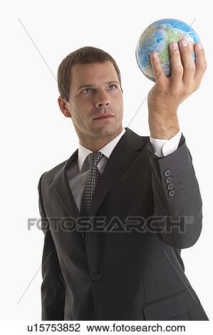 Man holding globe View Large Photo Image Stock Image - Man holding globe. Fotosearch