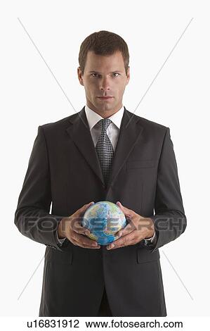 Man holding globe View Large Photo Image Stock Image - Man holding globe. Fotosearch