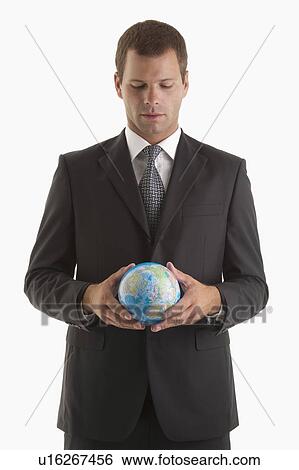 Man holding globe View Large Photo Image Stock Photograph - Man holding globe. Fotosearch