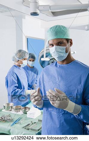 Medical personnel in operating room View Large Photo Image Picture - Medical personnel in operating room. Fotosearch