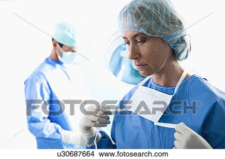 Medical personnel in operating room View Large Photo Image Picture - Medical personnel in operating room. Fotosearch