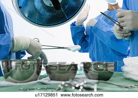 Medical personnel in operating room View Large Photo Image Stock Image - Medical personnel in operating room. Fotosearch