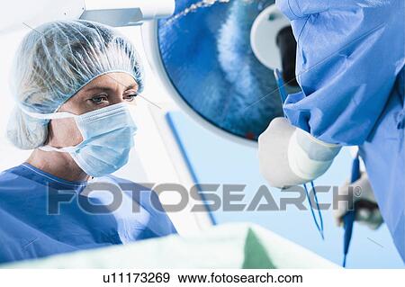 Medical personnel in operating room View Large Photo Image Stock Photo - Medical personnel in operating room. Fotosearch