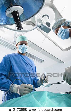 Medical personnel in operating room View Large Photo Image Stock Photo - Medical personnel in operating room. Fotosearch
