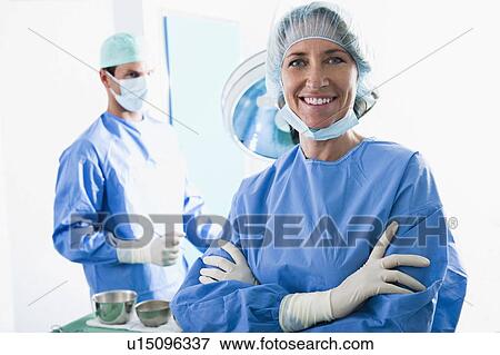 Stock Photo - Medical personnel in operating room. Fotosearch