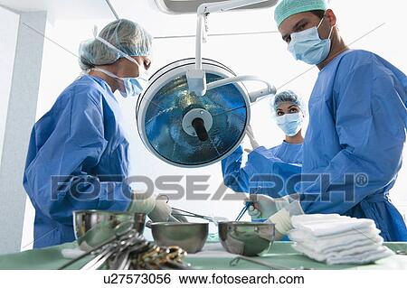Medical personnel in operating room View Large Photo Image Stock Photograph - Medical personnel in operating room. Fotosearch