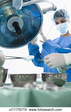 Stock Photography - Medical personnel in operating room. Fotosearch