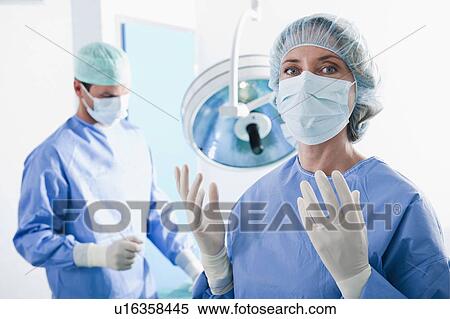 Stock Photography - Medical personnel in operating room. Fotosearch