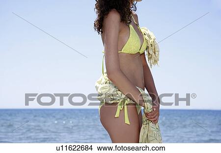 Middle of female young adult on the beach View Large Photo Image Picture - Middle of female young adult on the beach. Fotosearch