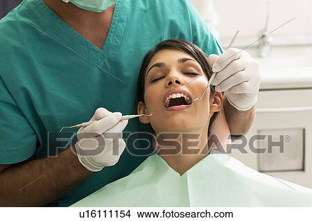 Patient at the dentist View Large Photo Image Picture - Patient at the dentist. Fotosearch