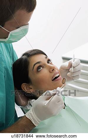 Patient at the dentist View Large Photo Image Picture - Patient at the dentist. Fotosearch