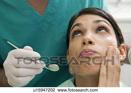 Patient with toothache at dentist View Large Photo Image Stock Image - Patient with toothache at dentist. Fotosearch