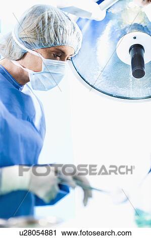 Surgeon in operating room View Large Photo Image Stock Image - Surgeon in operating room. Fotosearch