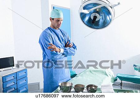 Stock Photo - Surgeon in operating room. Fotosearch