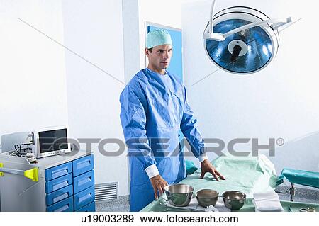 Stock Photo - Surgeon in operating room. Fotosearch