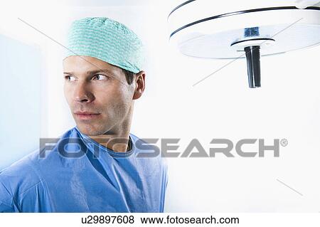 Surgeon in operating room View Large Photo Image Stock Photo - Surgeon in operating room. Fotosearch