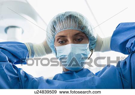 Stock Photo - Surgeon wearing surgical mask in operating room. Fotosearch