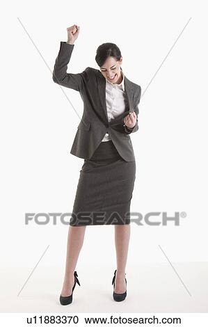 Stock Image - Woman holding fist up. Fotosearch