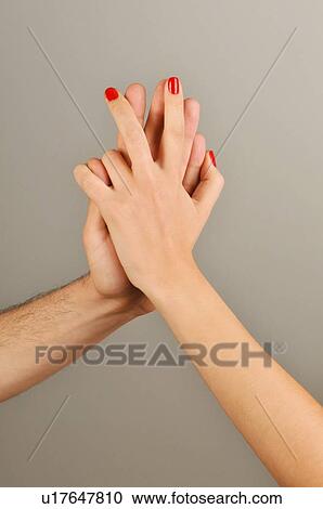 Young adult couple holding hands View Large Photo Image Stock Image - Young adult couple holding hands. Fotosearch