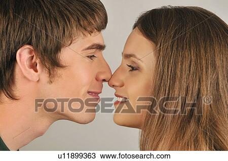 Young adult couple touching noses View Large Photo Image Stock Image - Young adult couple touching noses. Fotosearch