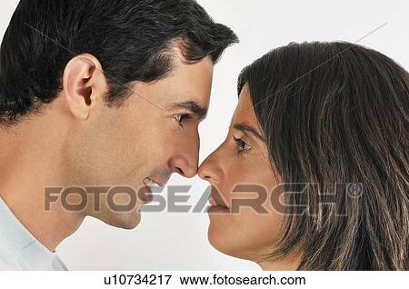 Young adult couple touching noses View Large Photo Image Stock Photo - Young adult couple touching noses. Fotosearch