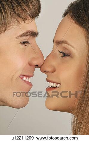 Young adult couple touching noses View Large Photo Image Stock Photo - Young adult couple touching noses. Fotosearch