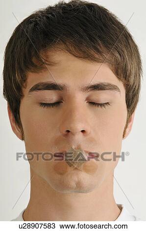 Young male adult; Band-Aids over mouth View Large Photo Image Stock Image - Young male adult; Band-Aids over mouth. Fotosearch