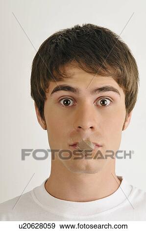 Young male adult; Band-Aids over mouth View Large Photo Image Stock Photo - Young male adult; Band-Aids over mouth. Fotosearch