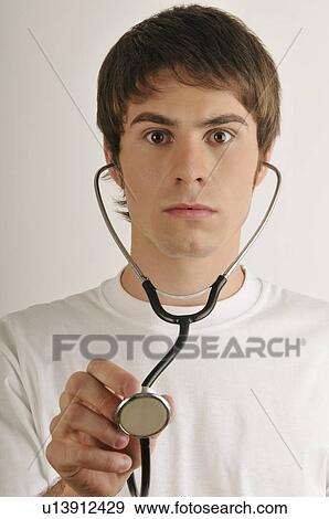 Young male adult drying neck with towel View Large Photo Image Stock Photo - Young male adult drying neck with towel. Fotosearch