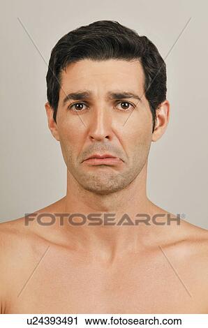 Young male adult face; upset expression View Large Photo Image Stock Image - Young male adult face; upset expression. Fotosearch