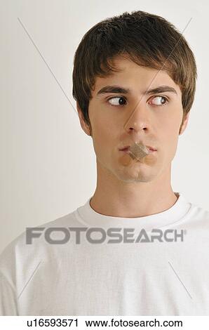 Young male adult; looking through fingers' hole View Large Photo Image Stock Image - Young male adult; looking through fingers' hole. Fotosearch