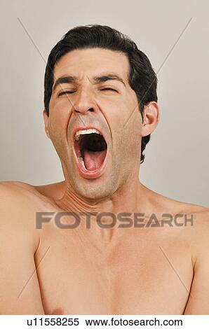 Stock Photography - Young male adult screaming. Fotosearch