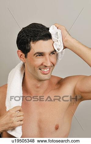 Young male adult towel drying View Large Photo Image Stock Photo - Young male adult towel drying. Fotosearch