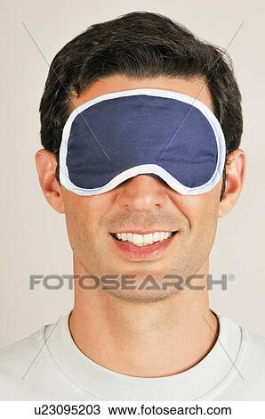 Young male adult with night shade over eyes View Large Photo Image Stock Image - Young male adult with night shade over eyes. Fotosearch