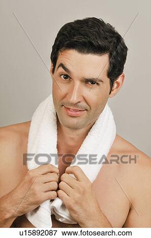 Stock Photo - Young male adult with towel around neck. Fotosearch