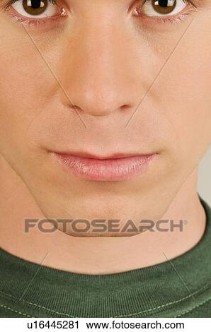 Young male adult's face close up View Large Photo Image Stock Image - Young male adult's face close up. Fotosearch