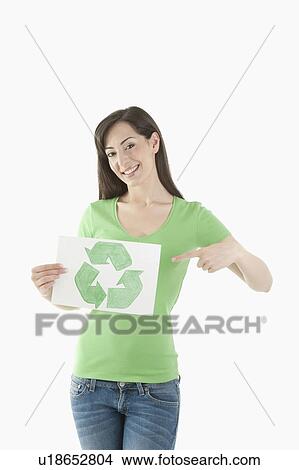 Picture - Young woman holding recycling symbol drawing. Fotosearch